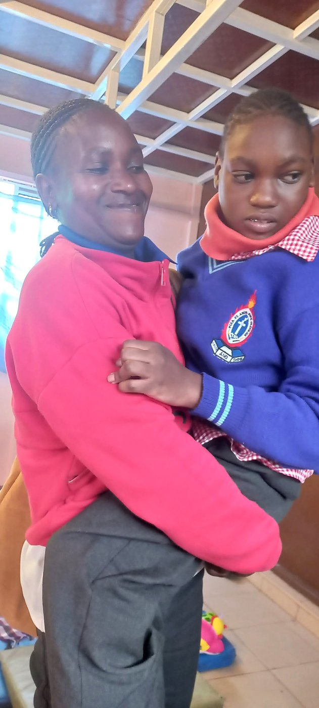 A mother holding her child at a GCIG event